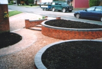 Gravel and brick raised plant beds